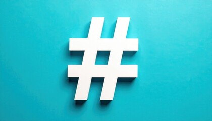 Obraz premium A prominent white hashtag symbol stands out against a vibrant teal or turquoise background, showcasing a clean, modern graphic element used for social media and online communication, highlighting...