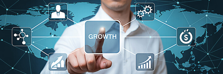Businessman touching growth button on a digital interface with a world map in the background