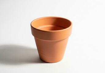 Empty terracotta pot for plants on a white background
