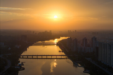 Suizhou City Hubei Province China landscape views show a sunset over a river with bridges.