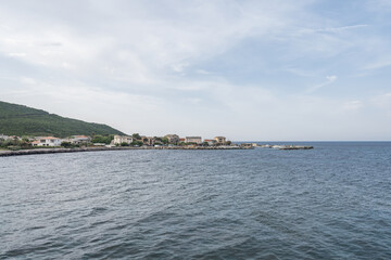 Naklejka premium Village beach view Roadtrip Winding road along rocky coast of Cap Corse peninsula on Corsica island France