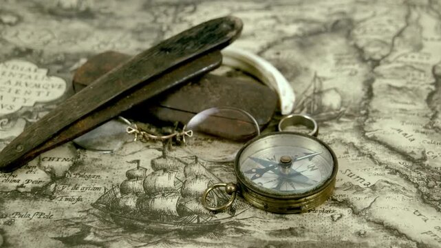 Magnetic compass on world map.Travel, geography, navigation, tourism and exploration concept background. antique compass on ancient map. Old vintage retro compass on ancient map background.