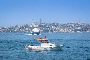 Obraz premium A small fishing and pleasure boat on the Bosphorus. istanbul, turkey.