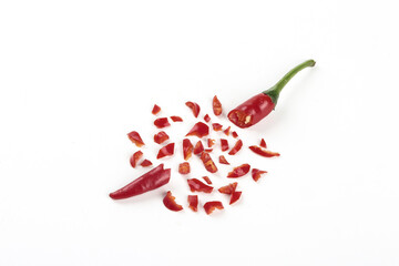Fresh Red Chili Peppers Chopped and Scattered on White Background