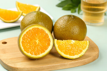 Fresh Australian Orange Slices on Wooden Cutting Board - Citrus Fruit Food Photography