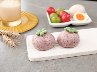 Purple Steamed Buns with Vegetable Tops Healthy Breakfast Food Styling on Marble Counter