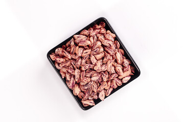 Colorful Dried Pinto Beans in Black Bowl - Raw Legumes for Cooking and Healthy Diet