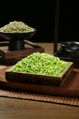 Fresh Green Mung Beans in Wooden Tray with Traditional Scales Agricultural Display