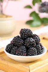 Fresh Blackberries in White Bowl on Wooden Board - Healthy Organic Berry Fruit
