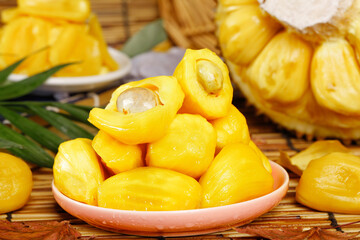 Fresh Thai Jackfruit Segments with Honey - Tropical Fruit Bowl on Bamboo Mat