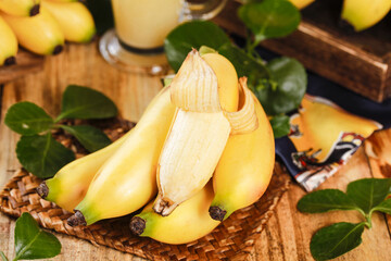 Fresh Ripe Bananas on Wicker Basket with Green Leaves - Tropical Fruit Display