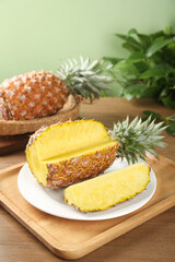 Fresh Golden Pineapple Slices with Sweet Yellow Flesh on Wooden Cutting Board - Tropical Fruit Production
