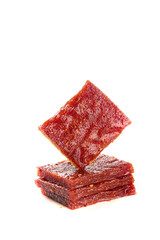 Spicy Red Beef Jerky Slices Stack on White Background - Gourmet Protein Snack Food