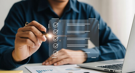 Close-up of person using digital checklist interface with laptop. Professional office setting with semi-transparent task management. Modern productivity tools with pen interaction.