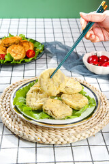 Deep Fried Eggplant Slices with Chopsticks - Delicious Asian Vegetarian Food on Woven Placemat