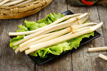 Fresh Lotus Roots with Lettuce on Wooden Table - Healthy Asian Vegetable Ingredients