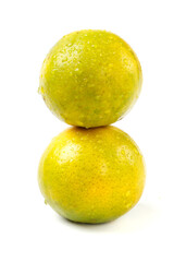 Fresh Green Citrus Fruits Stacked on White Background - Natural Healthy Food Photography