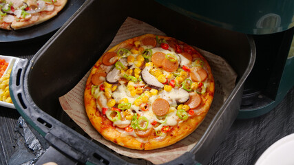 Grilled Italian Pizza with Cheese Sausage and Vegetables in Cast Iron Skillet
