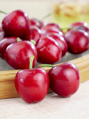 Fresh Red Meiyao Cherries from Shandong Province China on Wooden Surface