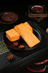 Crispy Seaweed Chips Snacks with Chili and Star Anise on Black Plate