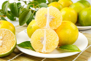 Fresh Guangxi Citrus Fruits Sliced on White Plates - Emperor Oranges from Wuming China