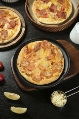 Grilled Italian Pizza with Cheese and Bacon Toppings in Cast Iron Skillet - Homemade Cuisine