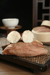 Shandong Sweet Potatoes with White Flesh on Bamboo Mat - Traditional Asian Root Vegetables