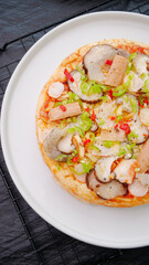 Fresh Italian Pizza with Mushrooms and Peppers on White Plate