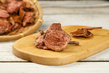 Dried Porcini Mushrooms on Wooden Board - Premium Cooking Ingredients