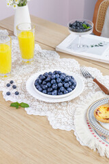 Fresh Blueberries and Orange Juice Elegant Breakfast Table Setting