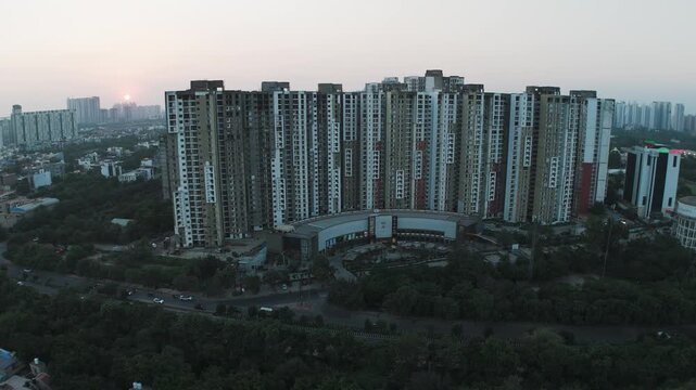 Modern Urban Living: Drone Shot of a Sprawling Apartment Society Against a Setting Sun