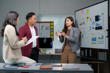 Business team collaborating on data analytics presentation