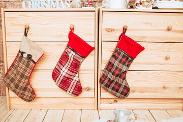 Christmas Stockings Hanging on Wooden Drawers