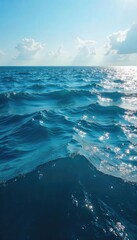 Fototapeta premium Vast expanse of deep blue ocean water, sunlit surface shimmering with waves, tranquil scene of marine environment , vast, marine environment