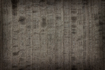 background is made of old wood. an old board. the texture of a rustic table. Eucalyptus, Mahogany, robusta, gray, wood, a place for a text or object, frame, vignetting,. the effect of aging