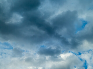 Dark Storm Clouds and Blue Sky Background