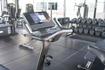 Exercise bike inside a gym. Workout or fitness concept.