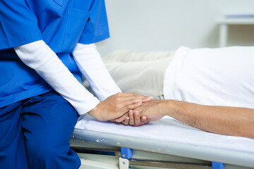 Obraz premium Caring therapist supports senior patient by holding hands. healthcare, elder care, rehab, emotional healing, human touch, and trust in medical environments.