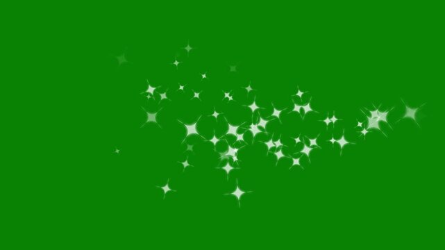Glitter particle trail entering from the left of the frame, fast-moving gold star dust particles across the screen, and star twinkle lights on a green screen background, useful for transition.