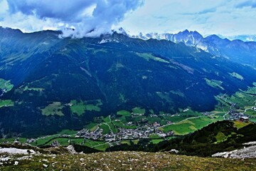 ustrian Alps - view of the Elferhütte and the Stubai Valley below the Elfer peak in Stubai Alps