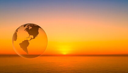 Earth globe at sunset over ocean