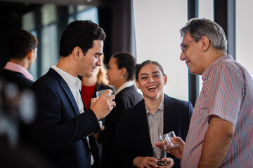 Business networking conversation among professionals during a corporate party, highlighting communication, teamwork, and leadership.