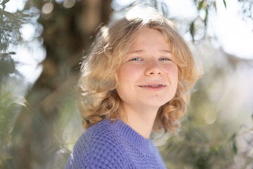 Young smiling girl wearing braces outdoors