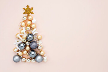 Christmas balls tree shape decor top view empty copy space background.Xmas backdrop.Minimal elegant decoration.New year elegant composition.