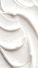 Close-up of creamy white substance with fine flecks of light brown