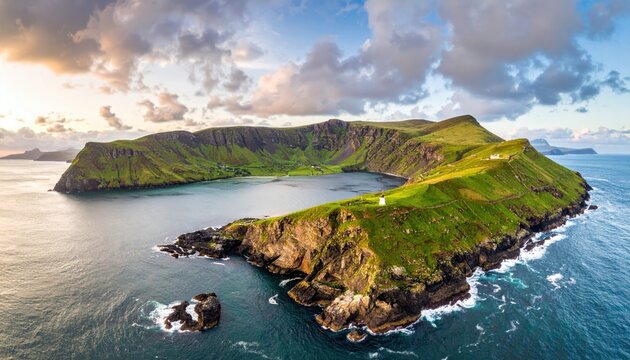 Breathtaking aerial view showcases a lush, green island surrounded by vast, deep blue ocean waters under a dramatic, cloudy sky illuminated by golden sunlight, highlighting the island's natural...