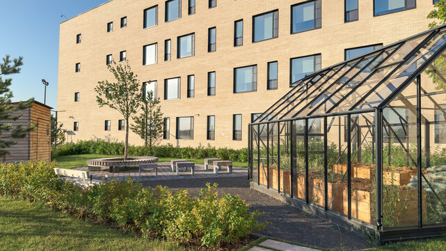 Modern school campus with greenhouse for educational gardening. Sustainable learning environment combining nature, science and eco-friendly education. and STEM projects.