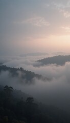 Fototapeta premium A serene landscape filled with soft clouds rolling over distant mountains at dawn