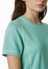 Woman wearing turquoise crew neck t shirt with yellow stitching