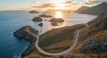 Scenic coastal landscape photograph with winding road islands and ocean under a sunset sky